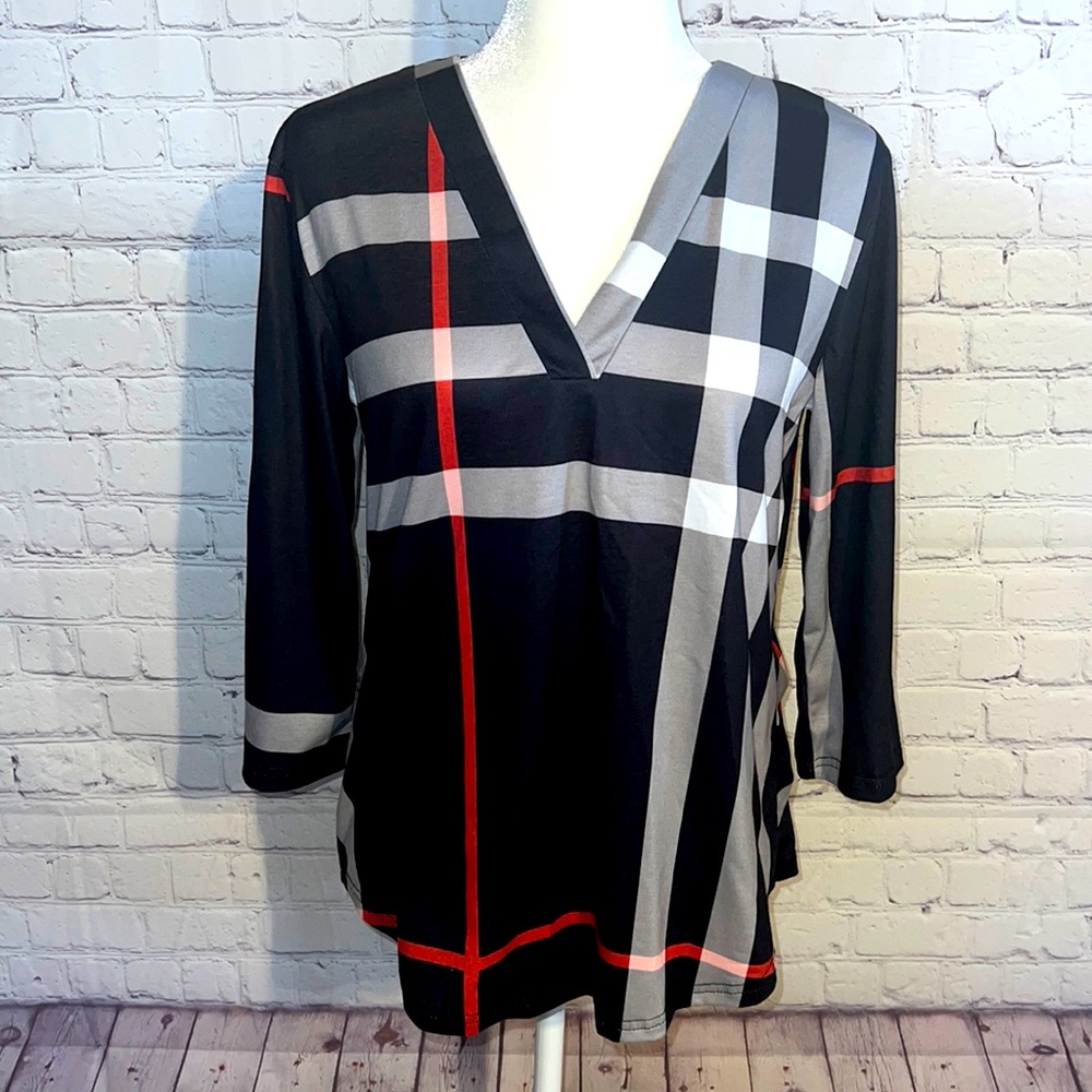V neck black,red and white top. Sleeve can be worn down or buttoned up. NWOT